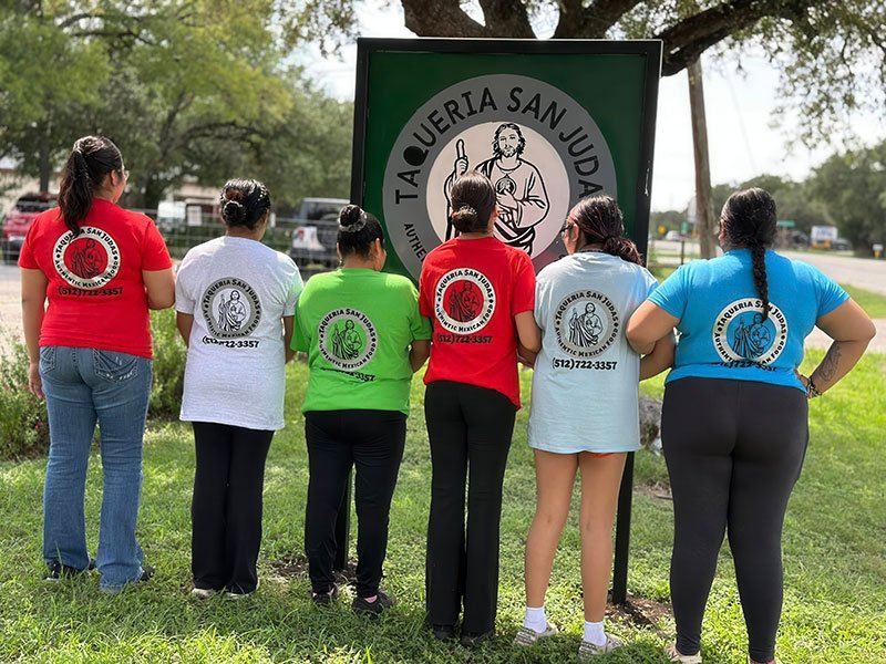 Owners of Taqueria San Judas in front of the restaurant